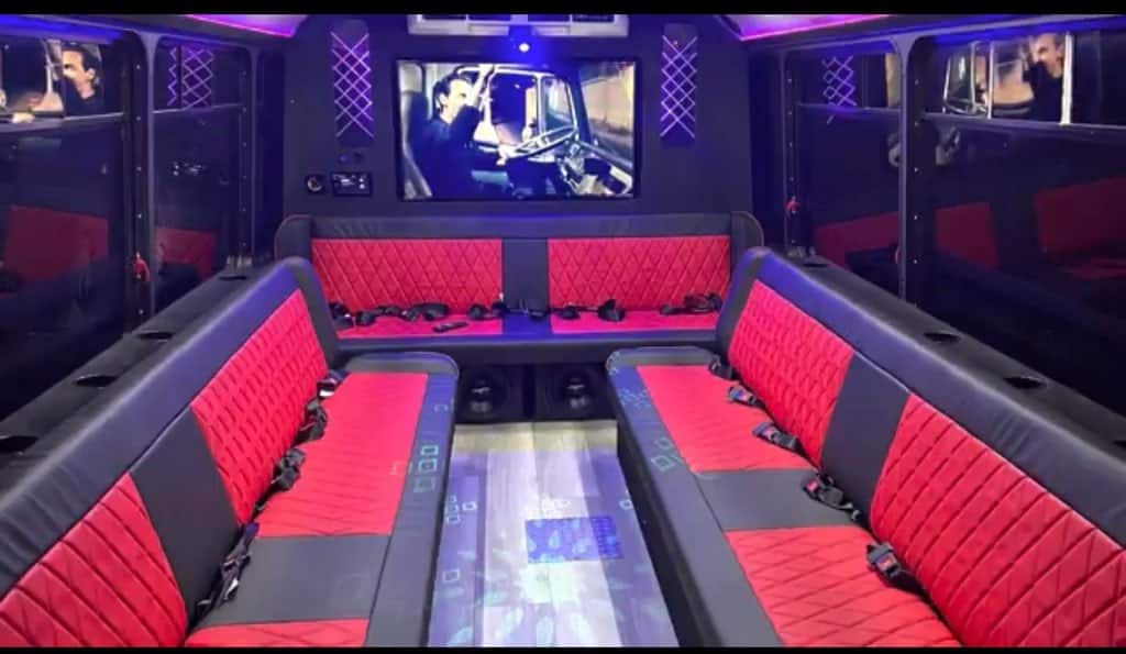 red and grey leather seats in the Hidden Secrets Luxury Party Bus