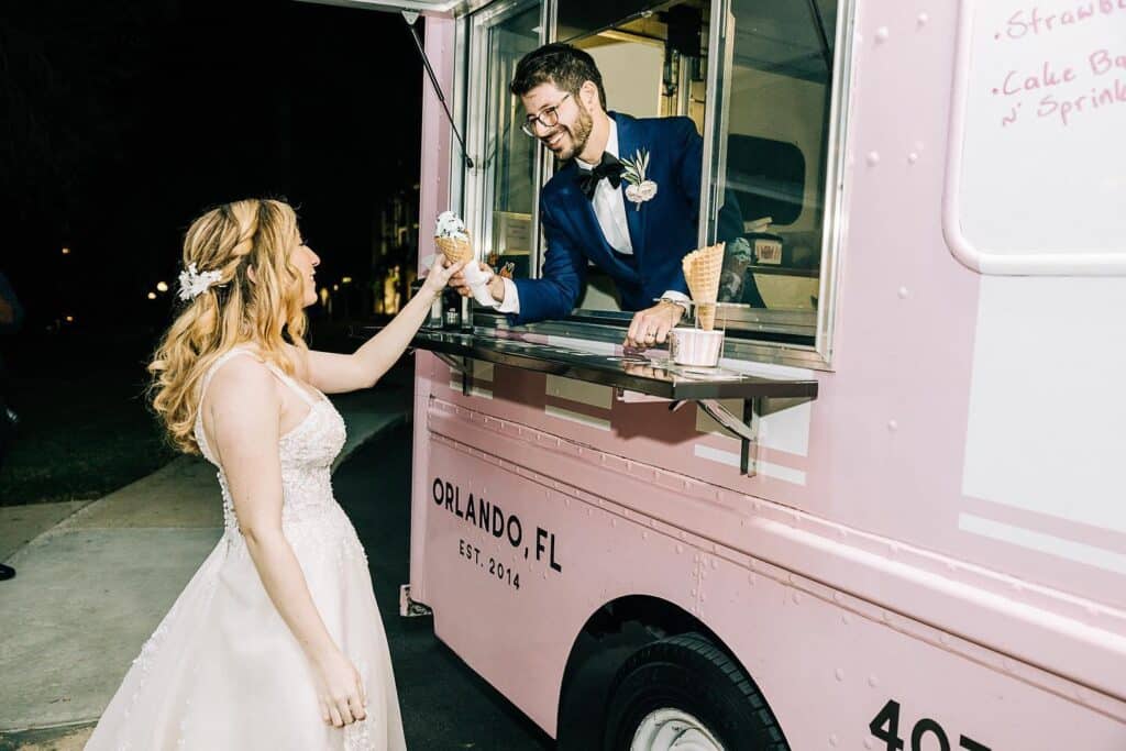 groom serving bride ice cream from Kelly’s Homemade Ice Cream truck