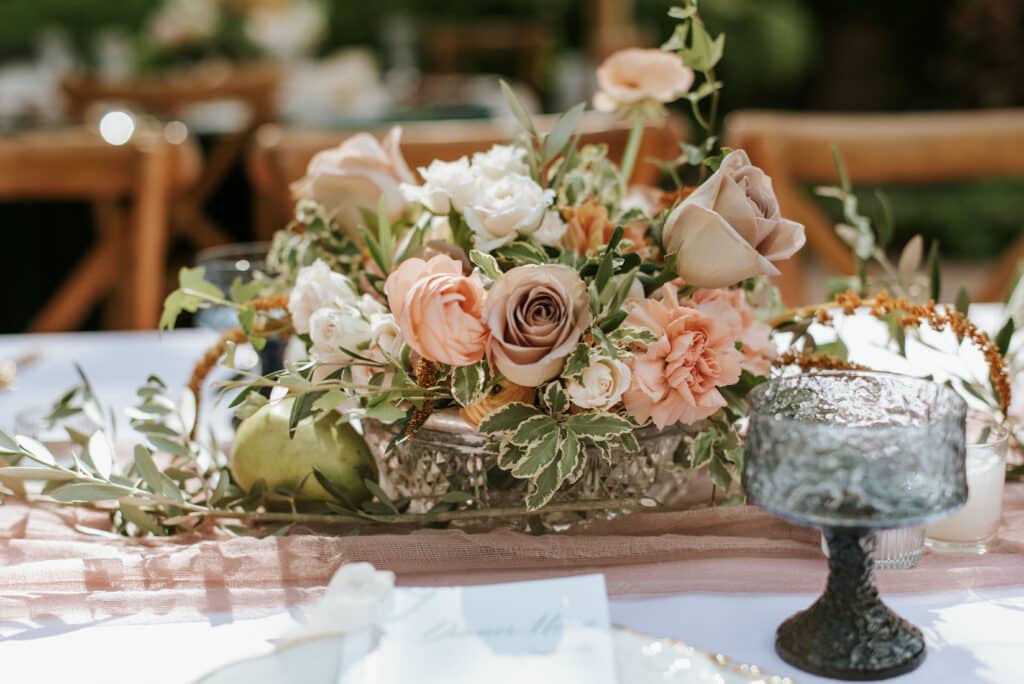 reception table centerpiece in roses and greenery from Sweet Pea Design Collective