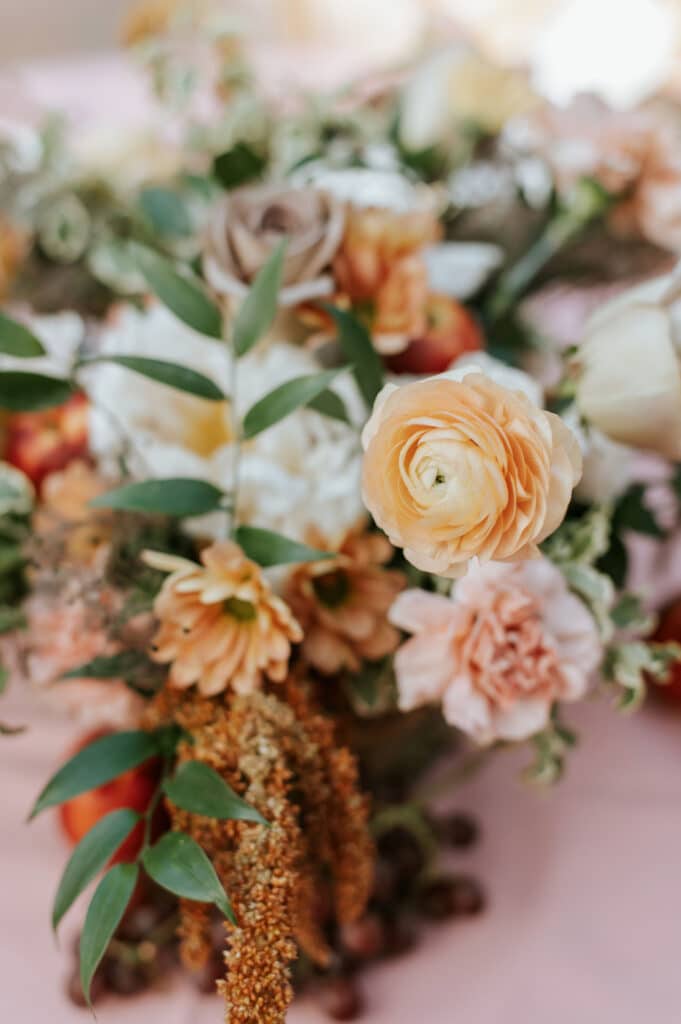 sherbert and orange table centerpieces by Sweet Pea Design Collective