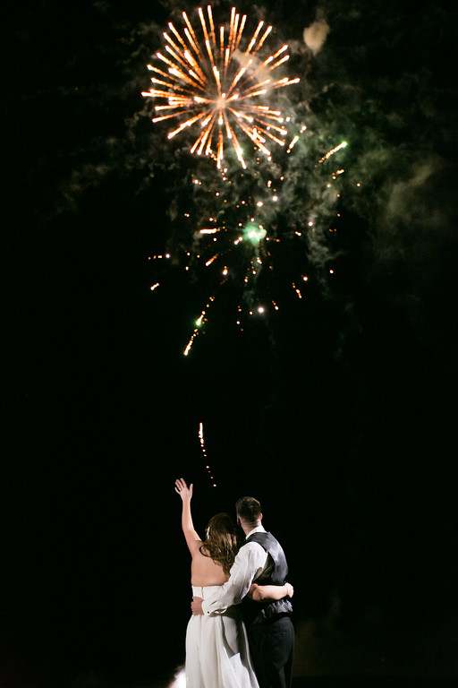 bride and groom watching starburst of fireworks from Orlando Special Effects