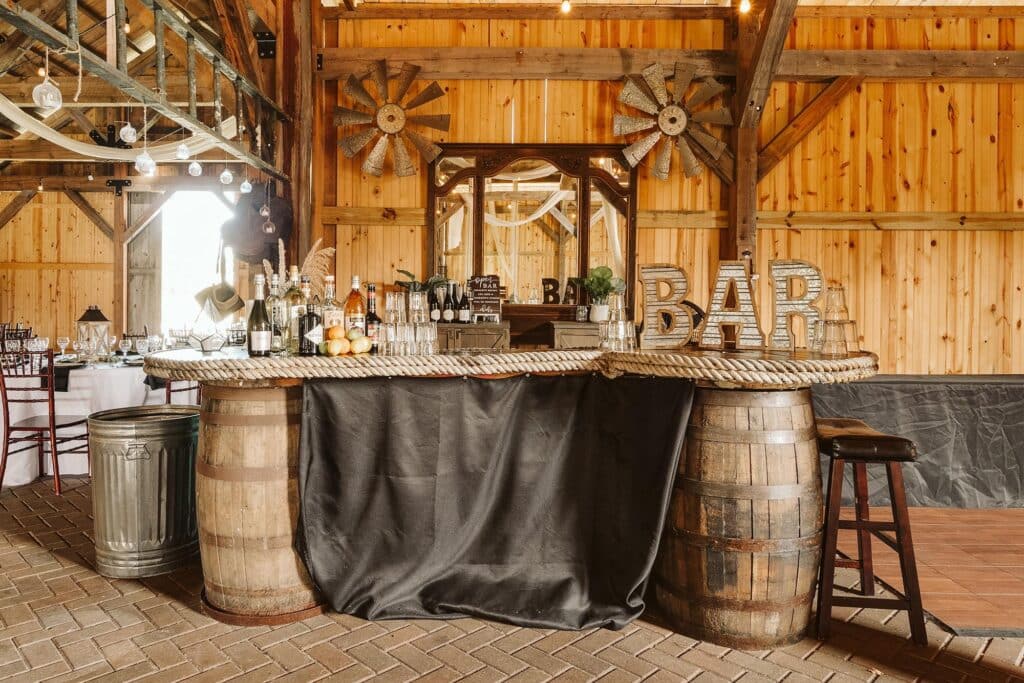 wooden barrel tables and stools bar setup at Bending Branch Ranch in New Smyrna Beach, FL