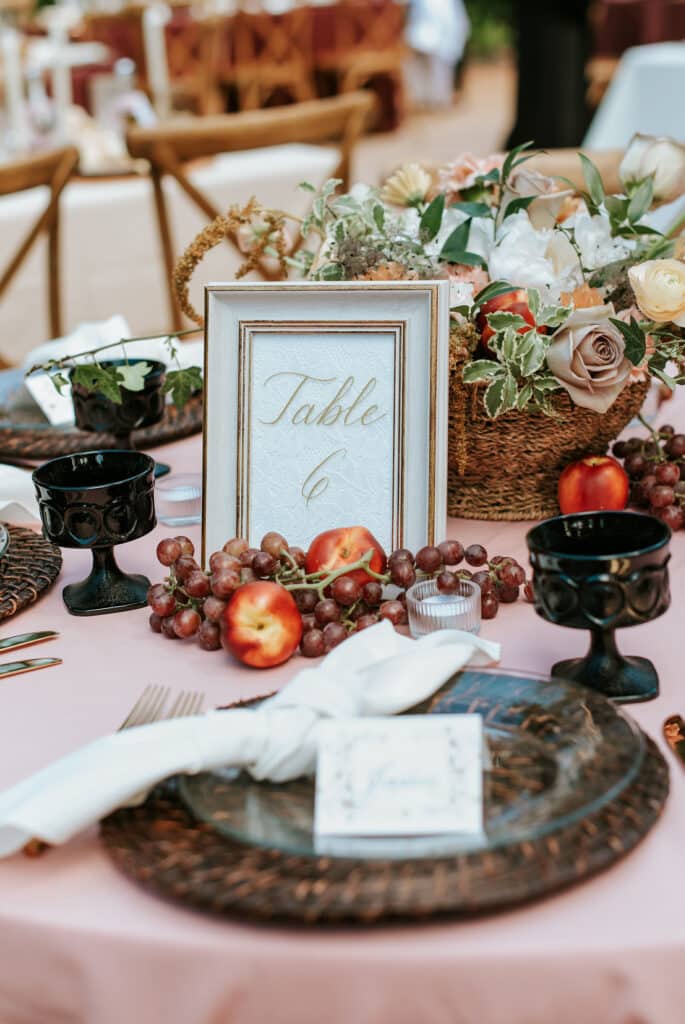 table number with centerpiece and place settings from Sweet Pea Design Collective