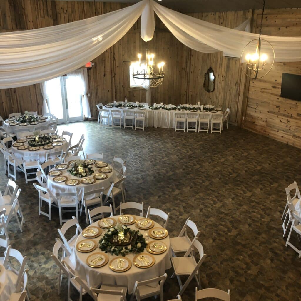 draped barn ceiling and round tables ready for reception room at the Diamond L Venue in Volusia County, near Deltona, FL