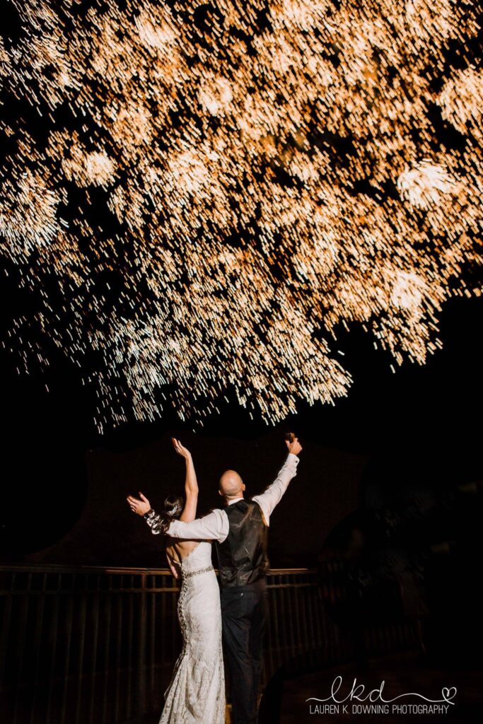 bride and groom looking to the sky and seeing what Orlando Special Effects can do