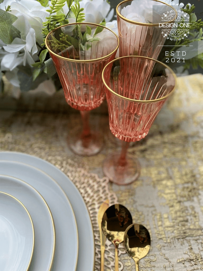 rose glass, gold flatware and white dinnerware from Design One USA