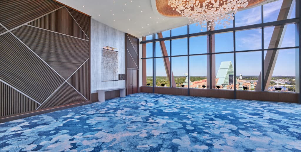 Walt Disney World Swan Reserve interior with blue carpet and view from higher floor