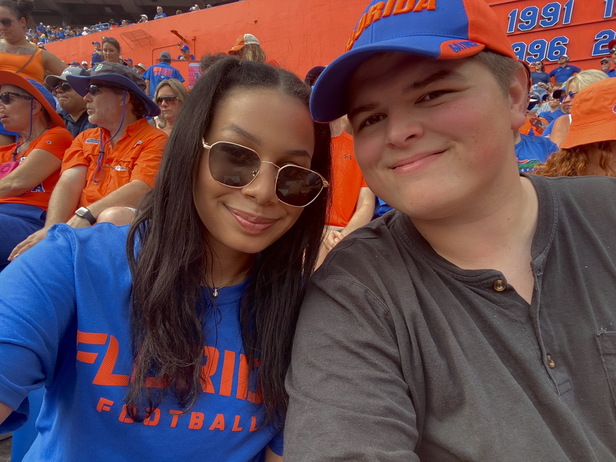 man and woman sit together at florida gators football game