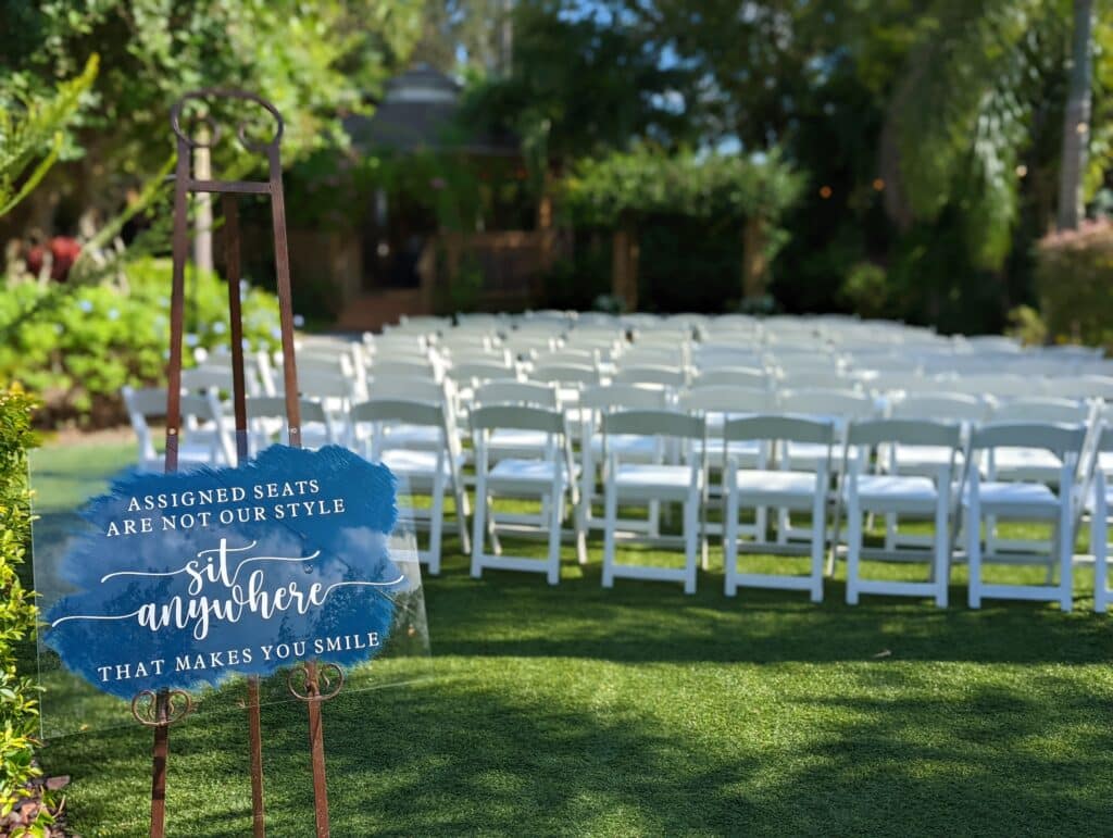 White chairs on Greenlawn waiting for wedding guests to arrive coordinated by Events by Rachel