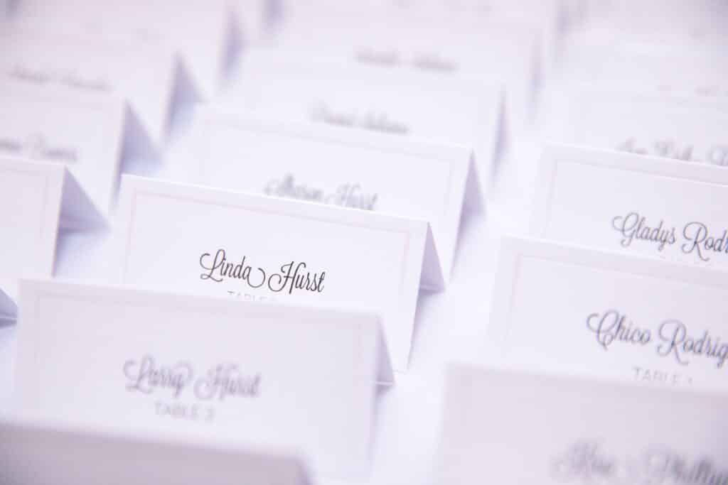 Close-up look at guest cards at wedding reception coordinated by Events by Rachel
