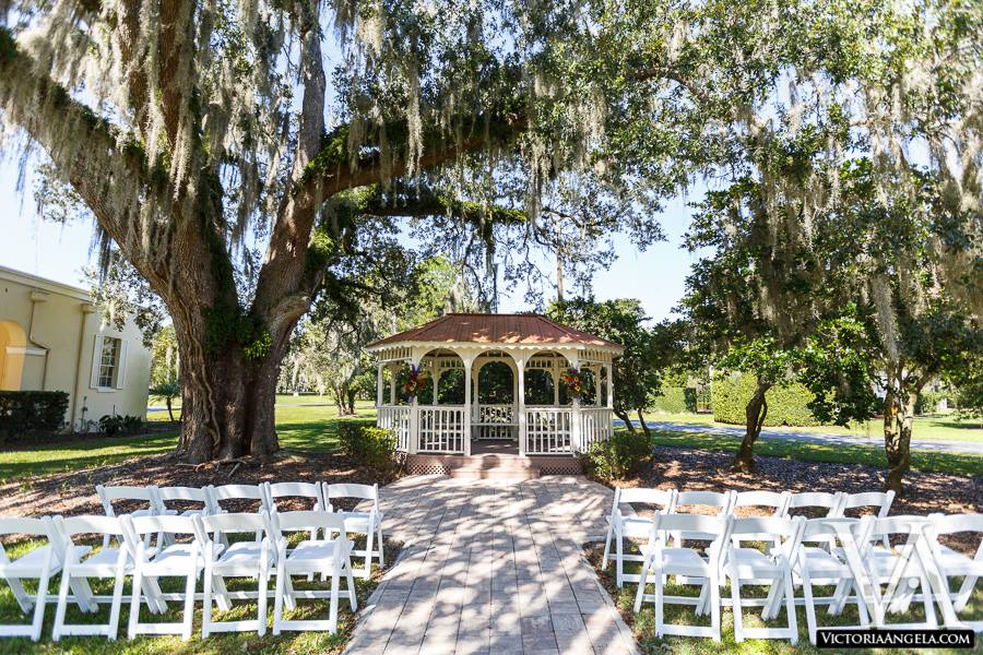 outdoor gazebo and white chairs set up for a ceremony at The University Club of Winter Park