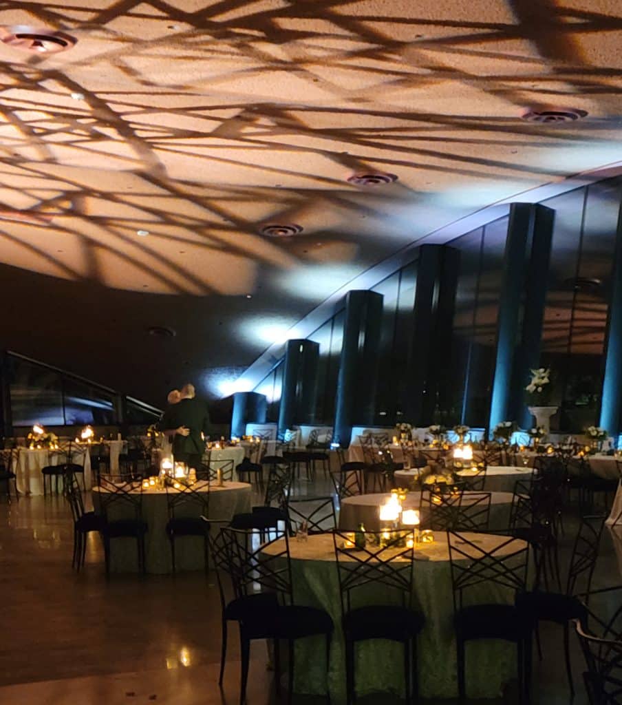 ceiling filled with lights over romantic tables lit with candle centerpieces at the Winter Park Events Center