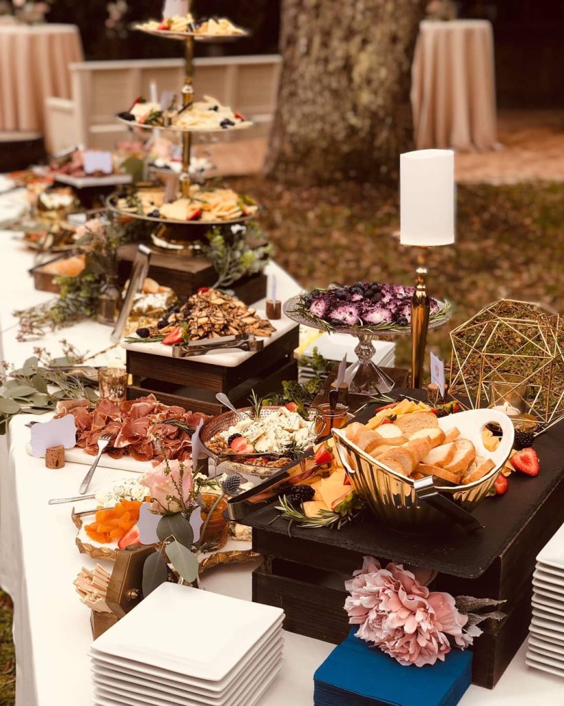 wedding buffet table of charcuterie by Uncommon Catering