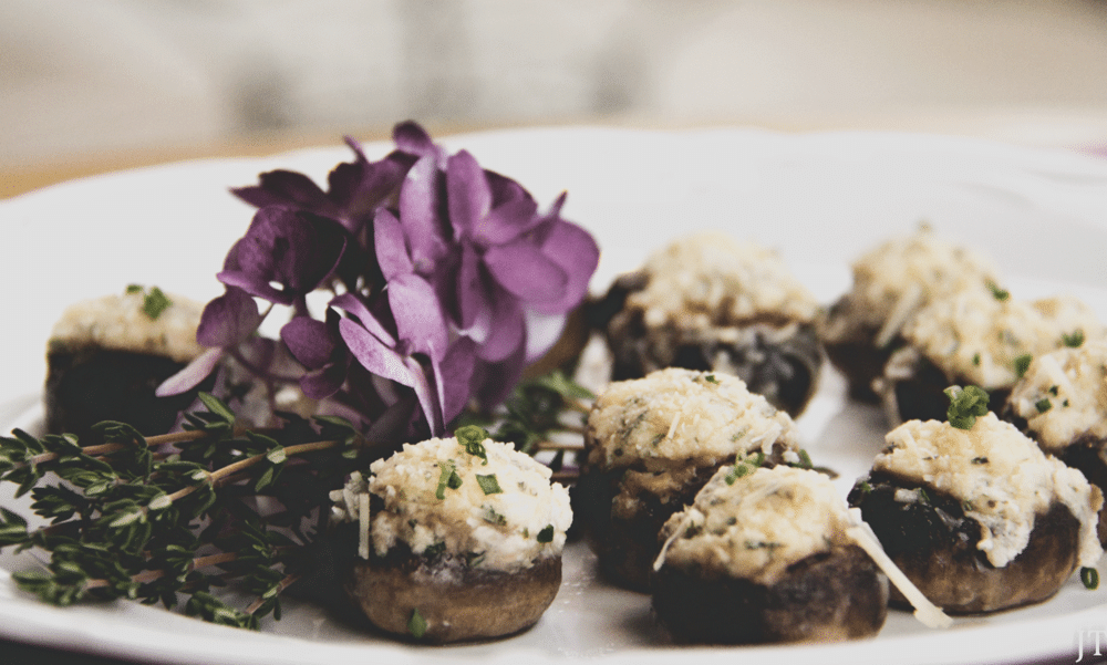 stuffed mushrooms with artichoke and cheese filling by Uncommon Catering
