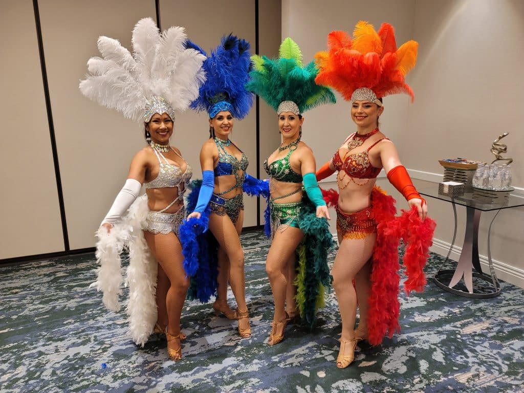 Showgirl costumed women from Entertainment City Productions