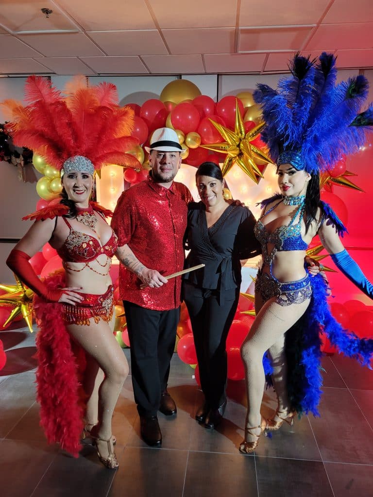 Las Vegas style showgirls at party with couple from Entertainment City Productions