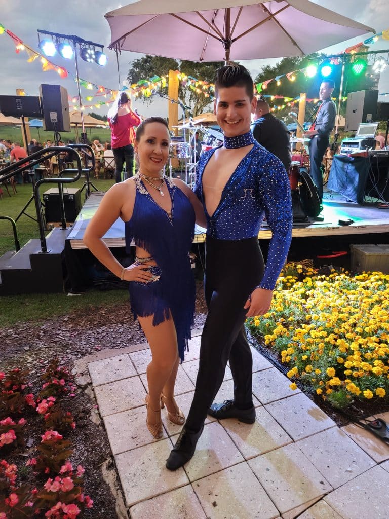 ballroom dancers in blue from Entertainment City Productions