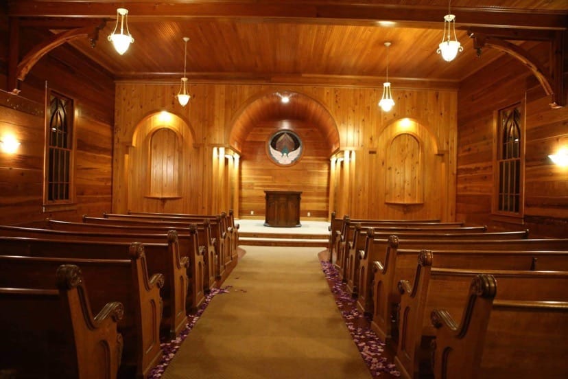 wooden wedding ceremony nave with wooden arches and walls