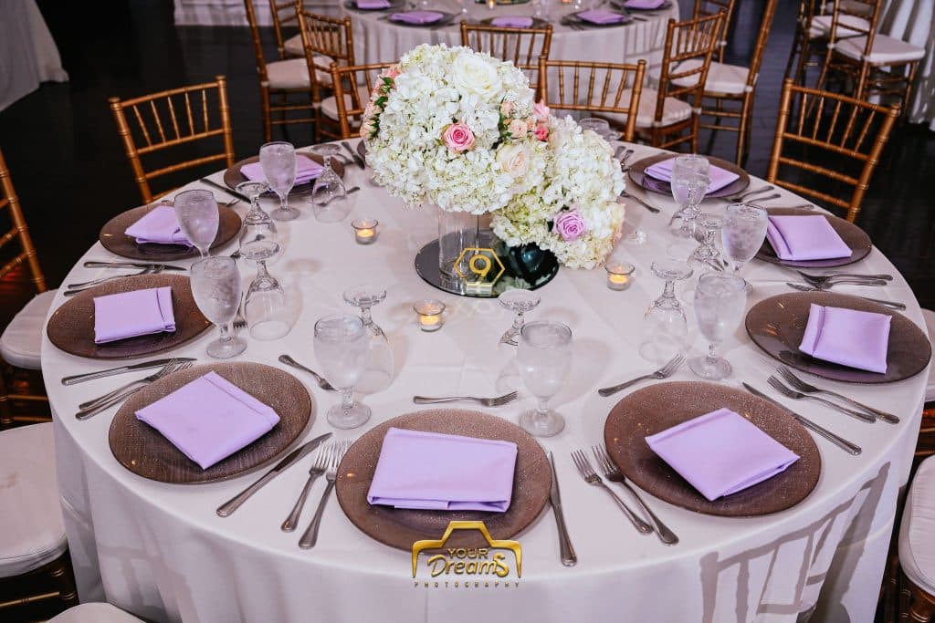 round tables set in pinks, golds and whites planned by Soulovevent LLC