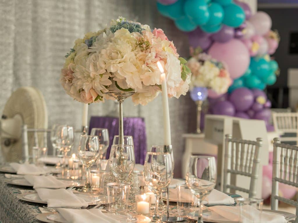 colorful wedding reception with balloon arches in pinks, turquoises and lavender planned by Soulovevent LLC
