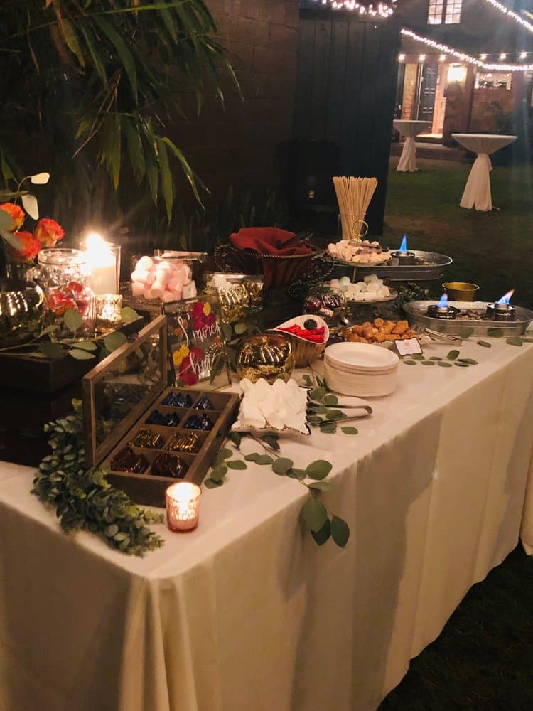 dessert table with cakes and chocolate fountain by Uncommon Catering