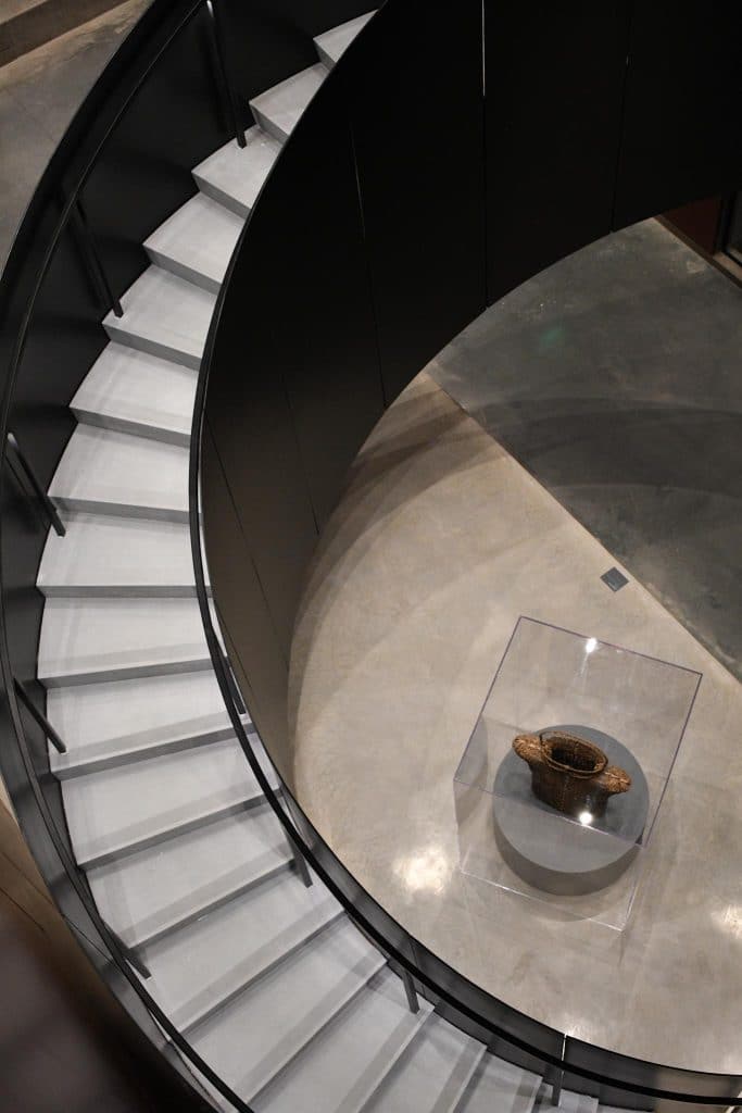 modern cement staircase descending to marble foyer at the Winter Park Events Center