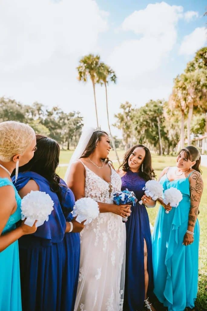bride with bridesmaids in shades of blue and turquoise at La Cita Country Club