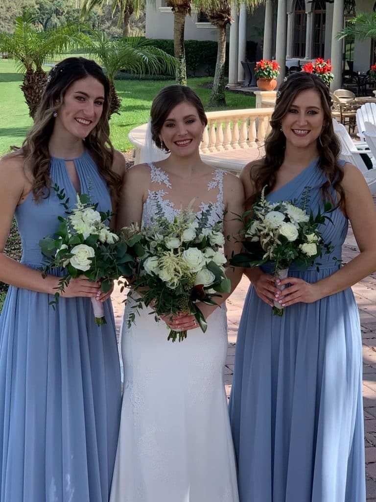 bride and bridesmaids in hydrangea blue with white flower bouquets by Ian Tafoya Designs