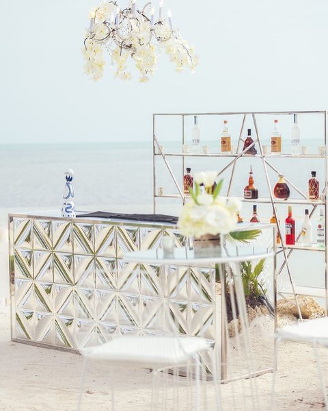 outdoor glass bar against backdrop of the ocean by Bubble Design Rentals Orlando