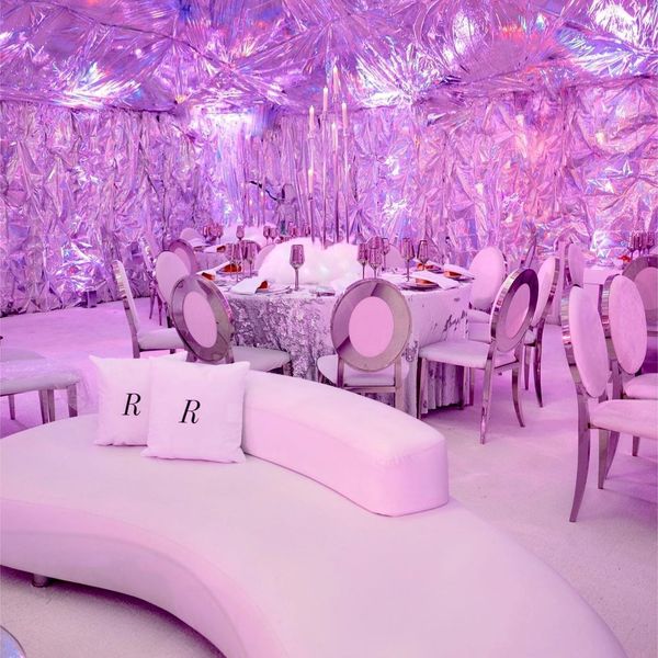 pink couches, pink chairs, pink tables, pink walls all with a pink filter by Bubble Design Rentals Orlando