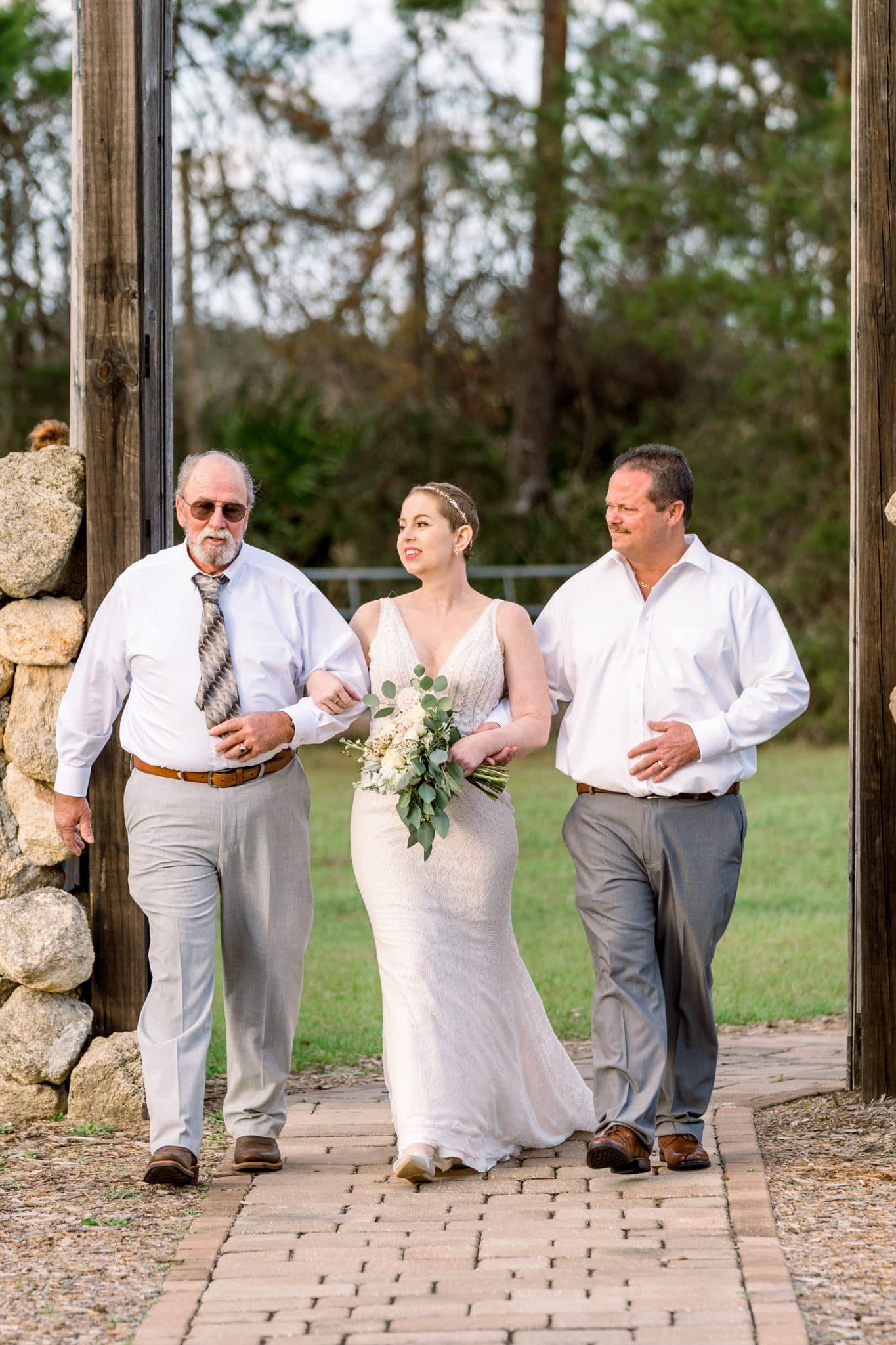 Bride walks down the isle with father.