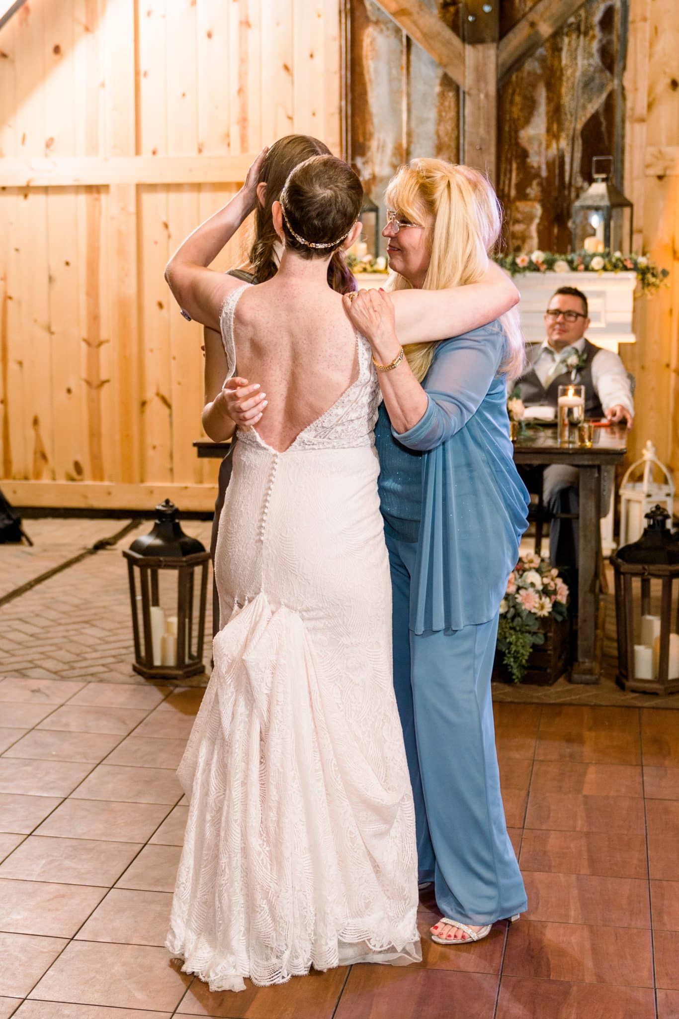 Bride dances with mother and daughter at Bending Branch Ranch