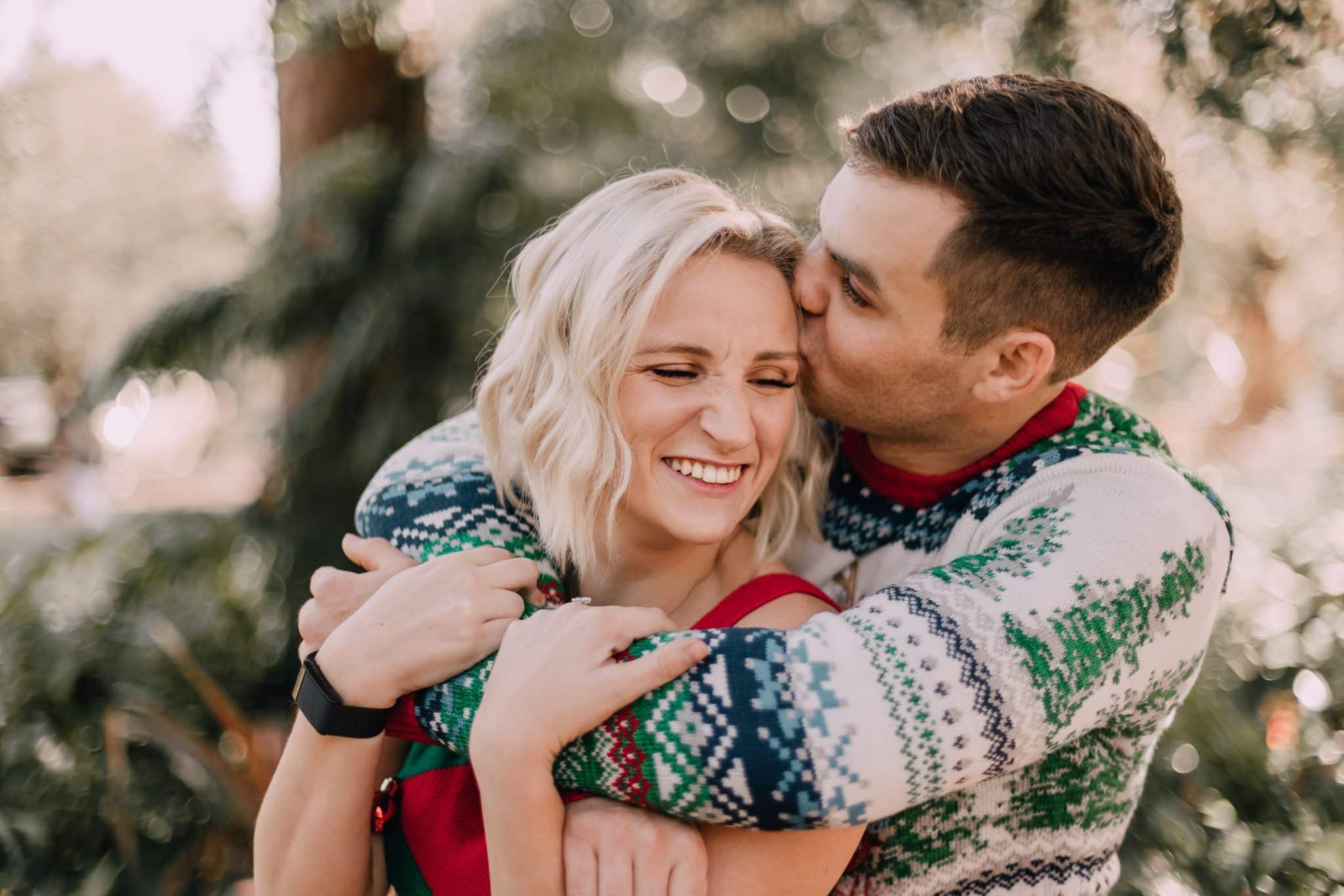 couple embraces in holiday attire