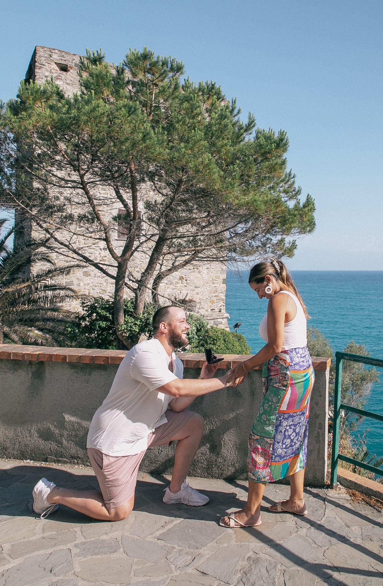 Christian is down on one knee for a surprise proposal in Italy to Nicolle