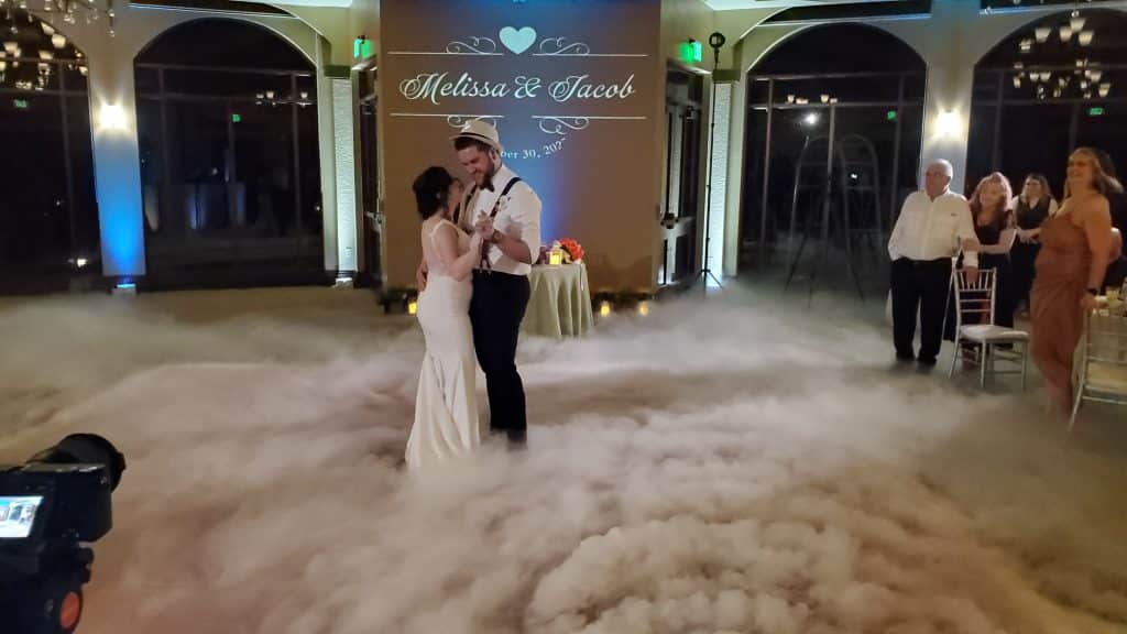 bride and groom dancing on a cloud to music from Elegant Entertainment DJ and Video Services Orlando