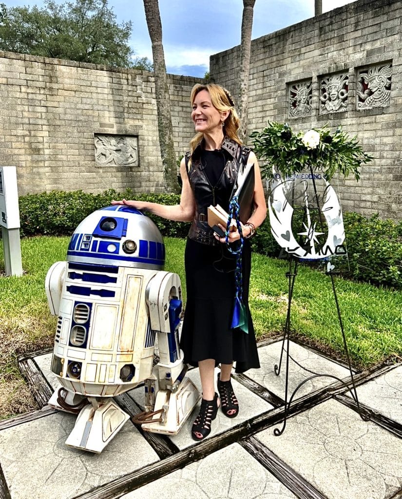 R2D2 with officiant from Freebird Ceremonies in a brick courtyard