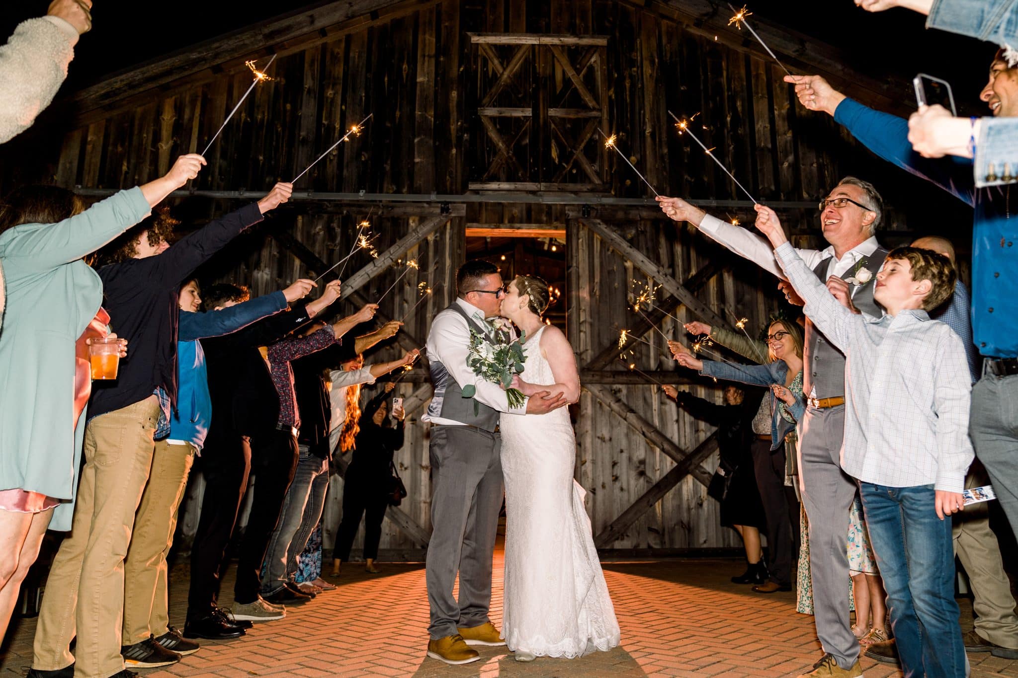 Couple exits their wedding vow renewal reception at bending Branch Ranch with a sparkler exit