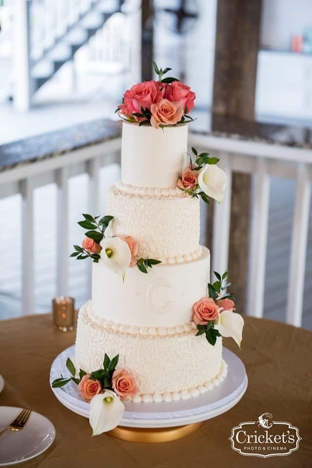 classic tiered wedding cake with orange roses by Cake & Bake