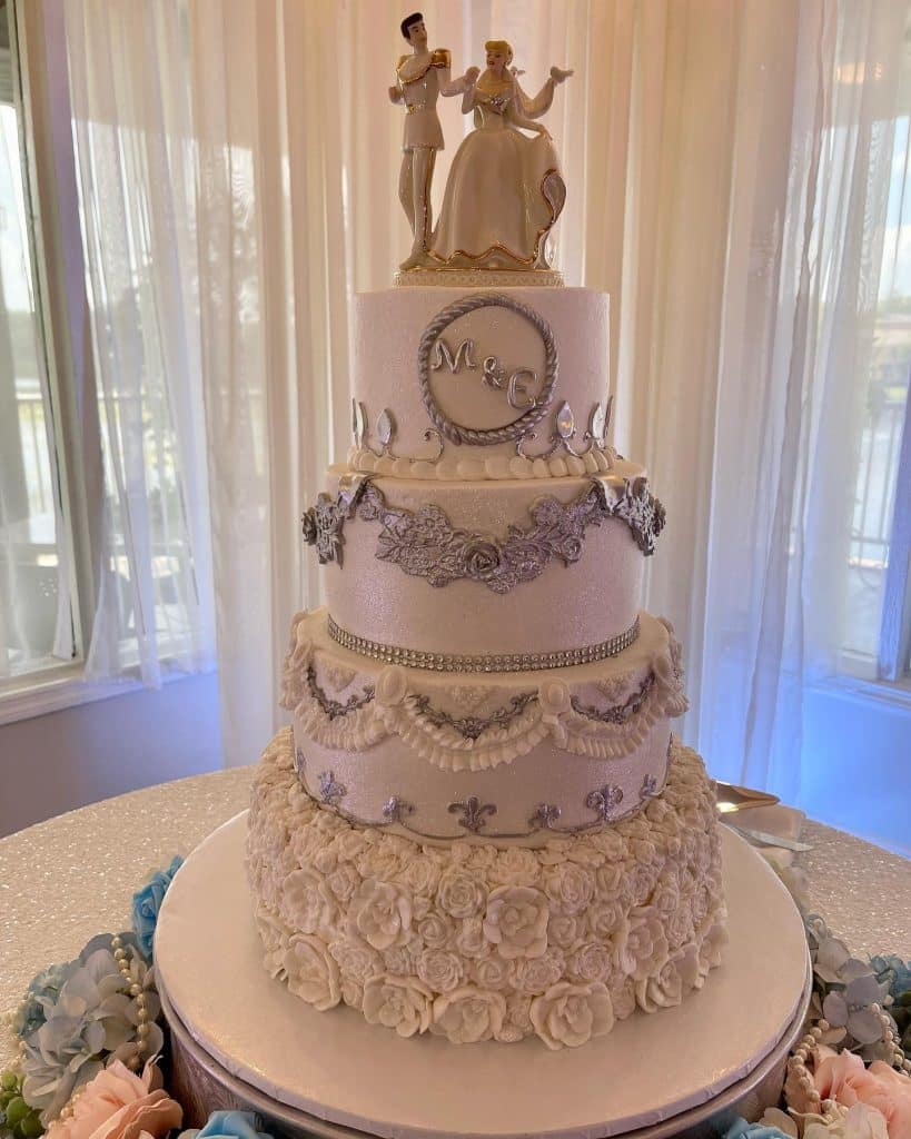 pretty and ornate four tiered wedding cake by Cake & Bake