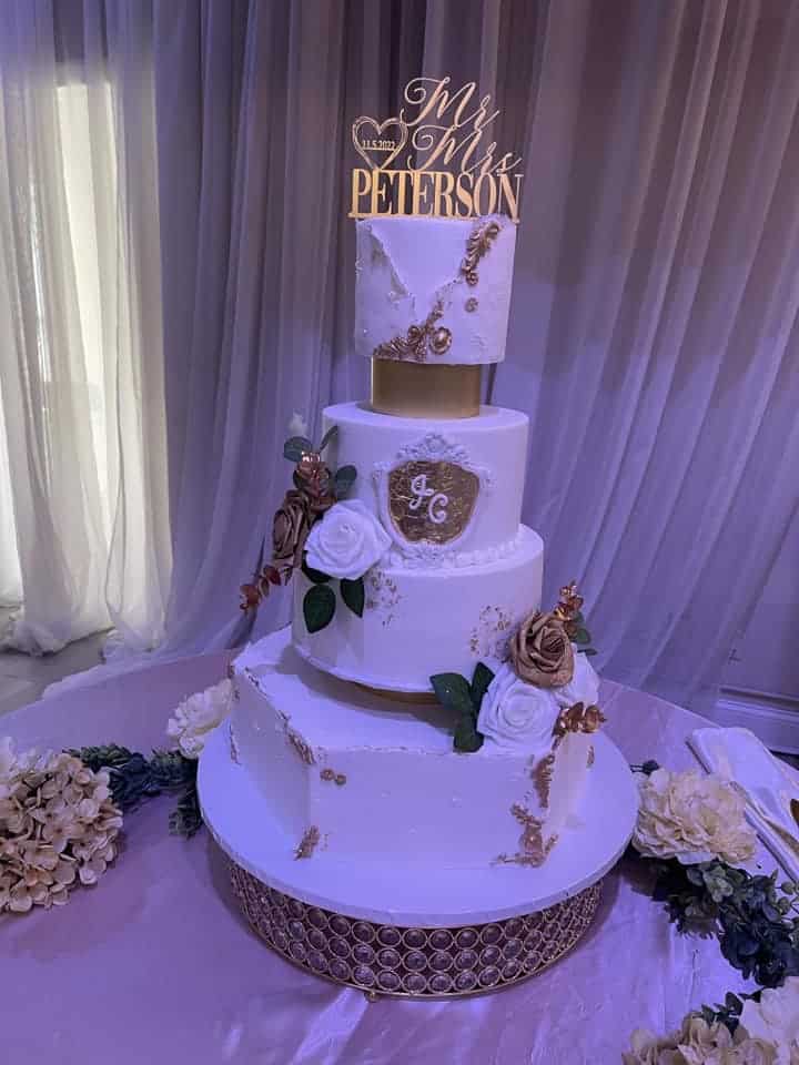 white and gold tiered wedding cake by Cake & Bake