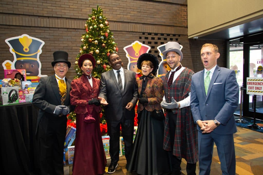 A group of carolers sing during an event