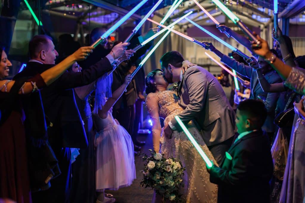 light sabre wedding arch exit photographed by Ashley Jane Photography