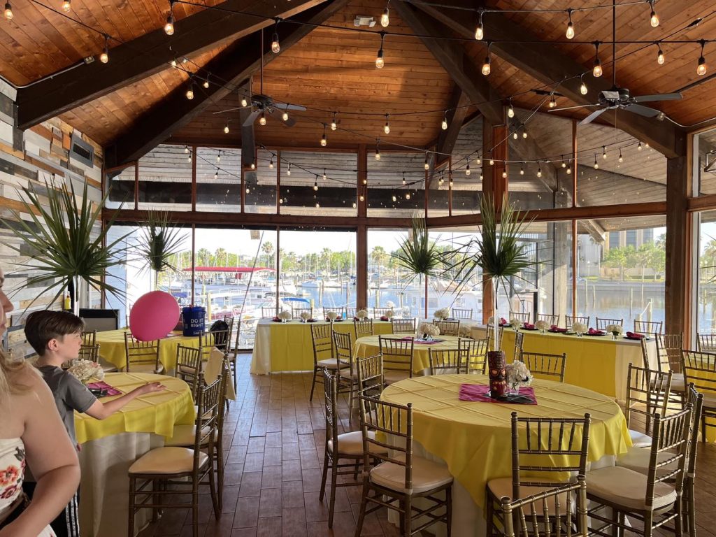 room set for special event with yellow and pink table accents at 520 on the Water