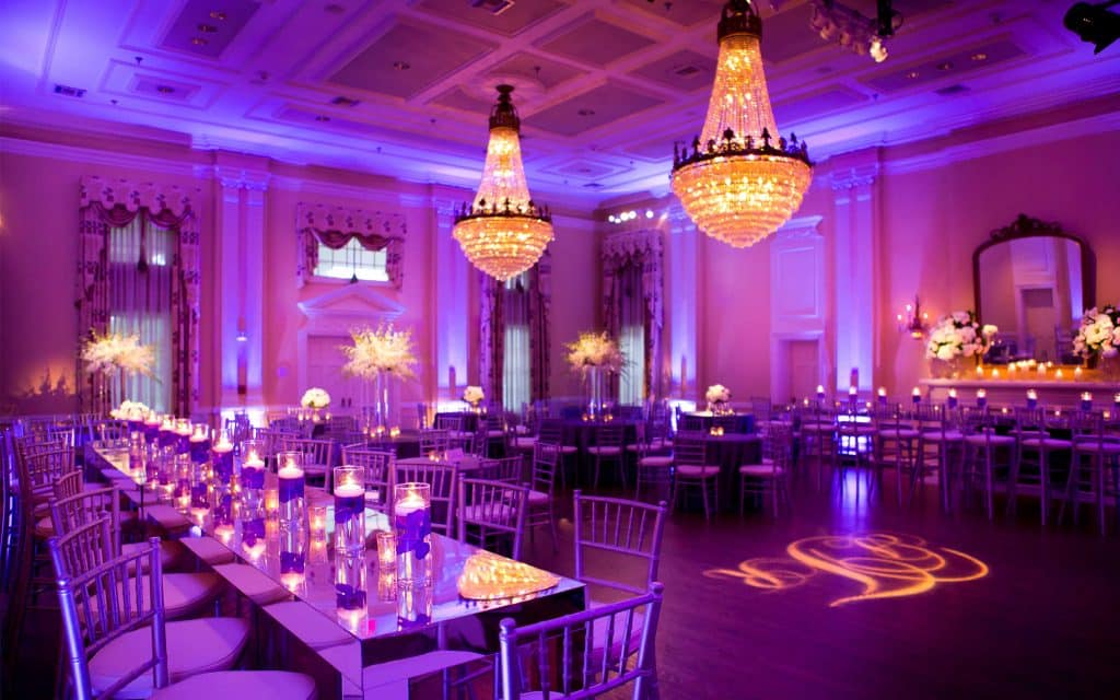 lighted initials provided by by COS Celebrations on the dance floor under chandeliers