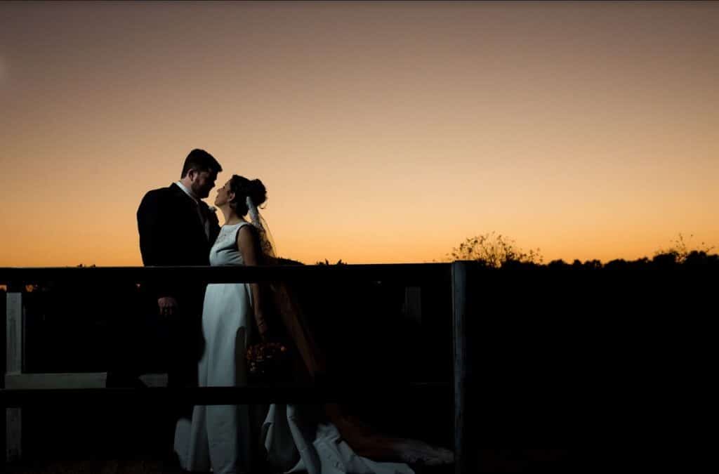 bride and groom at sunset at the Rocking L Ranch Wedding Barn