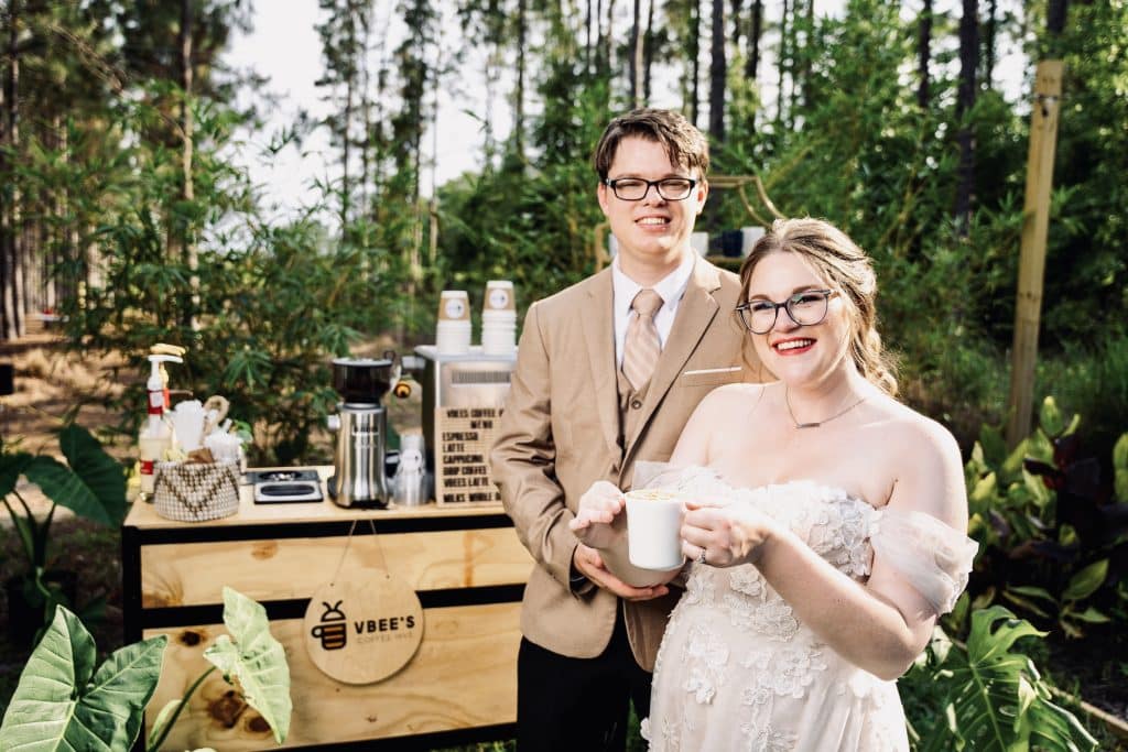 bride and groom having coffee at outdoor set-up from VBee’s Coffee Hive