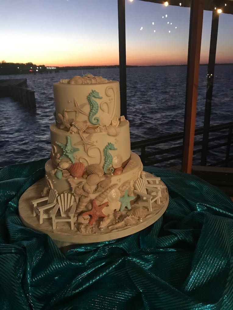 wedding cake at 520 on the Water at sunset