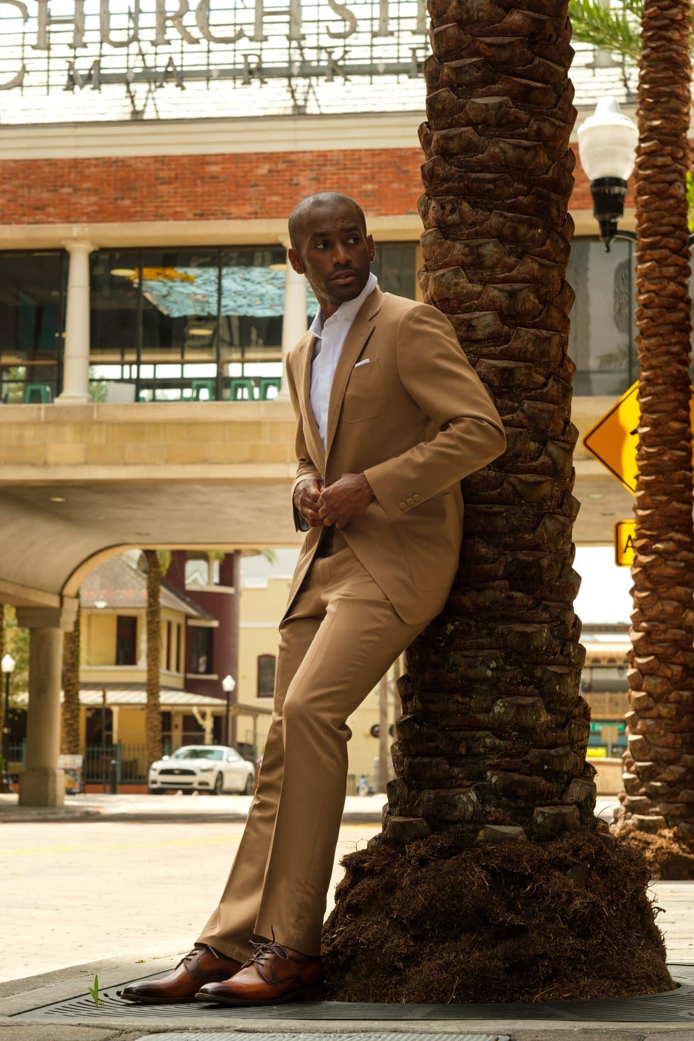 Gentleman models Winter Park's Leonardo 5th Avenue tan modern men's suit