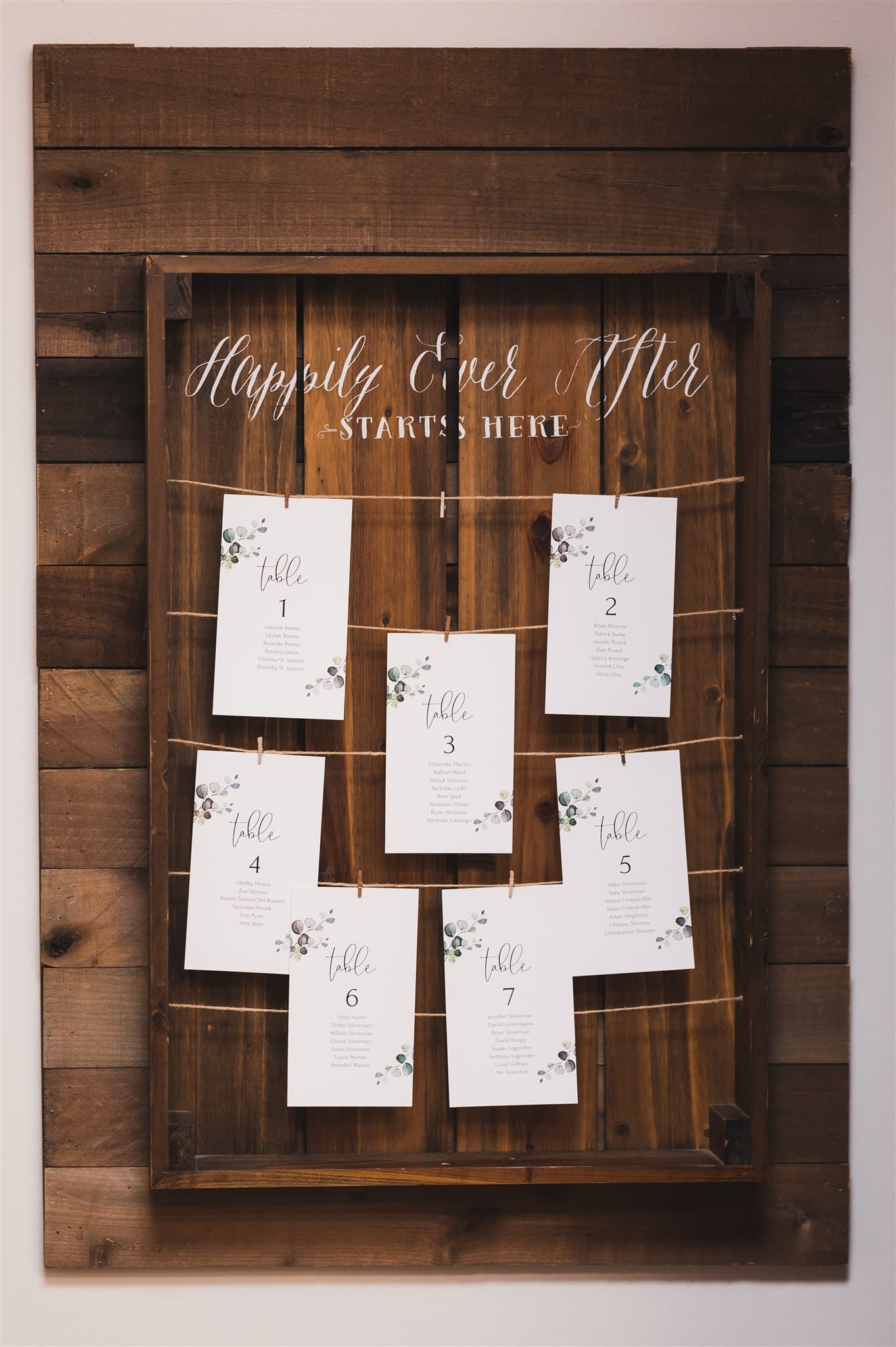 Seating chart for unique and stylish wedding at Trellis 925 that reads "Happily ever After starts here"