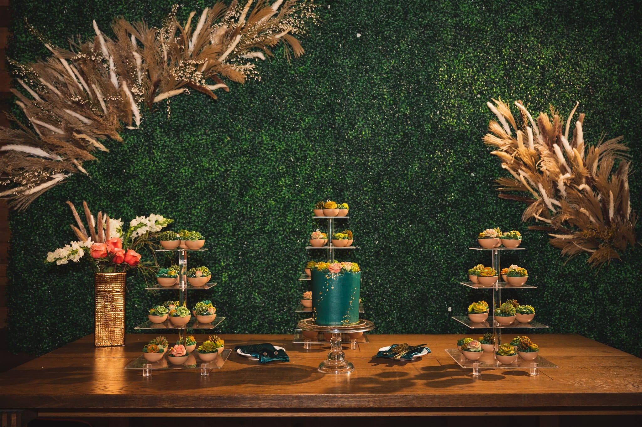 Dessert table and party favors of succulent plants at wedding venue Trellis 925